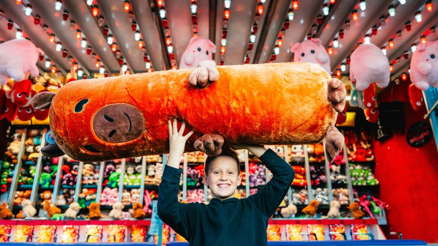 Kid holding a plushie 