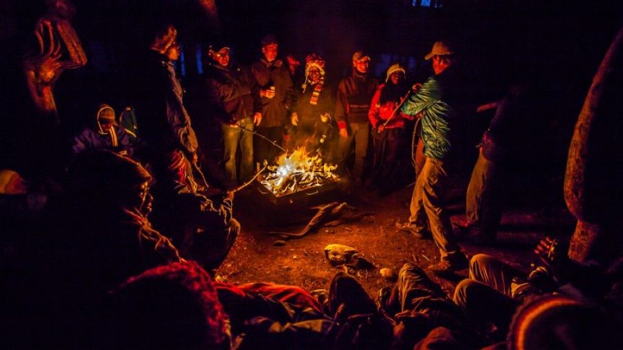 people gathered at campfire