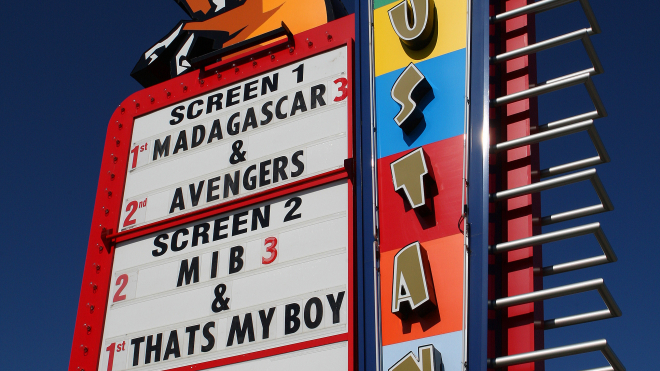 Movie sign from mustang drive in showing what movie are playing for that evening