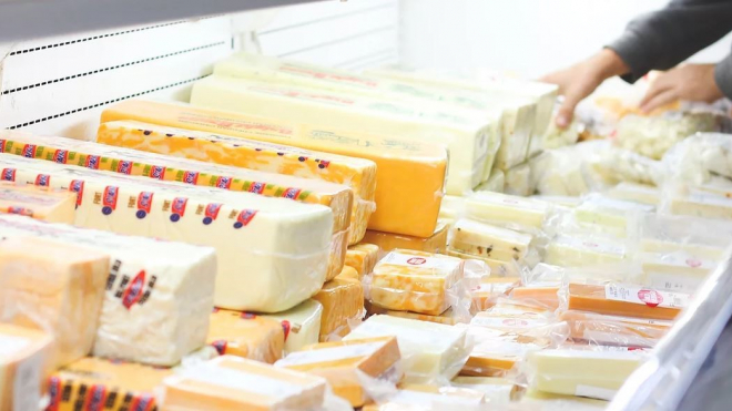 Variety of cheeses in a fridge 