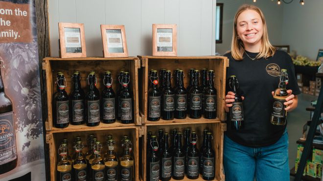 Woman and cider bottles 