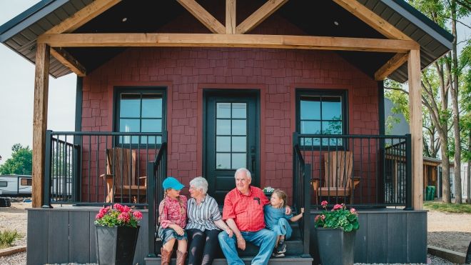 family on porch of accomodation