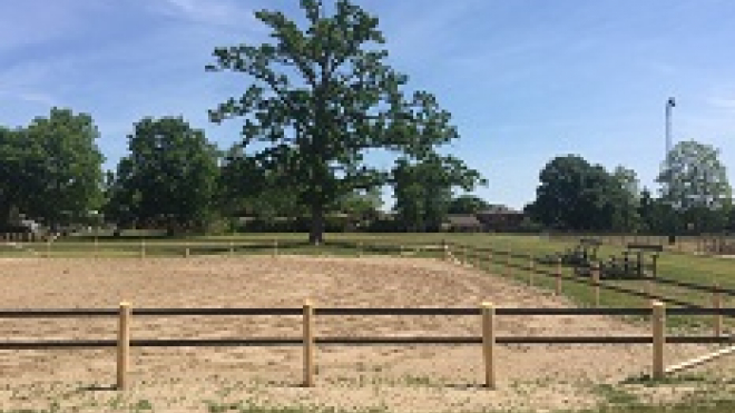 the fence of a stable at fair grounds 