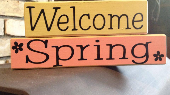 a sign that says "welcome spring" in yellow and orange by homegrown creations