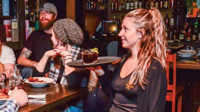 waitress serving a group of people