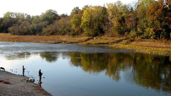 Thames River opening at Springbank, as the sun sets upon three fishermen