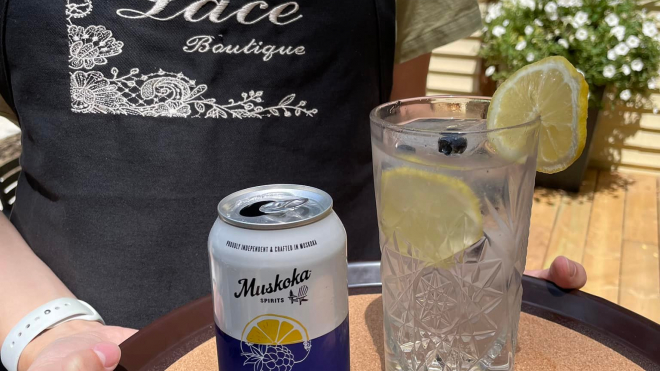 lace boutique apron with two drinks infront 