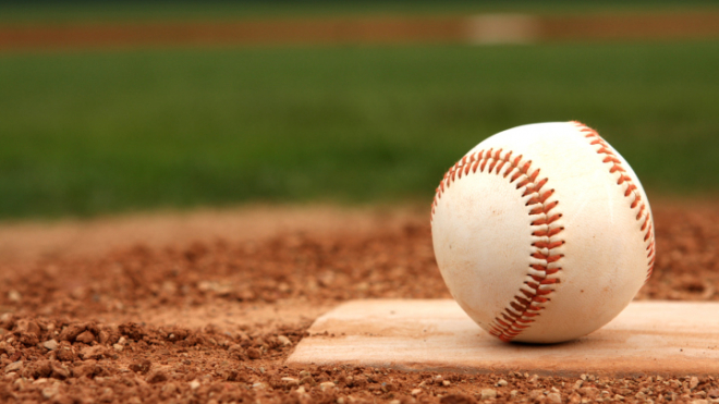 baseball on one of the bases of a baseball field 