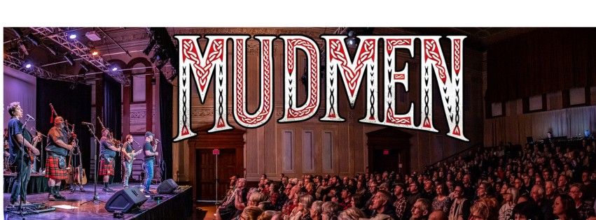Concert promotional banner for Mudmen featuring the band performing on stage in front of a seated audience, with large stylized “Mudmen” text displayed prominently above.