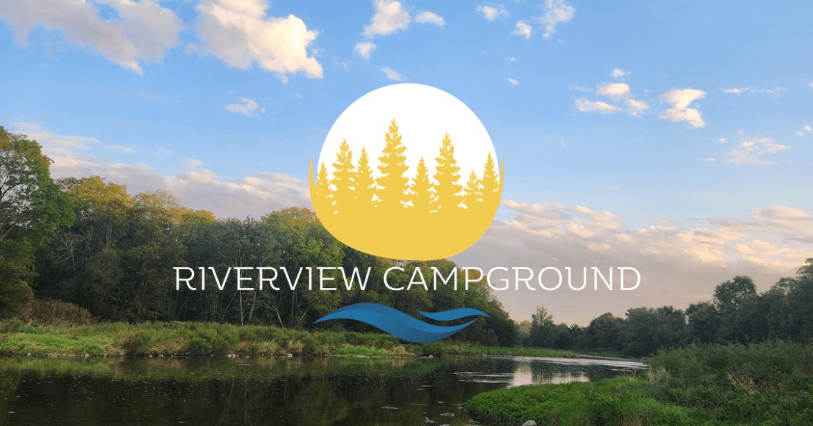 riverview campground logo over a river at sunset