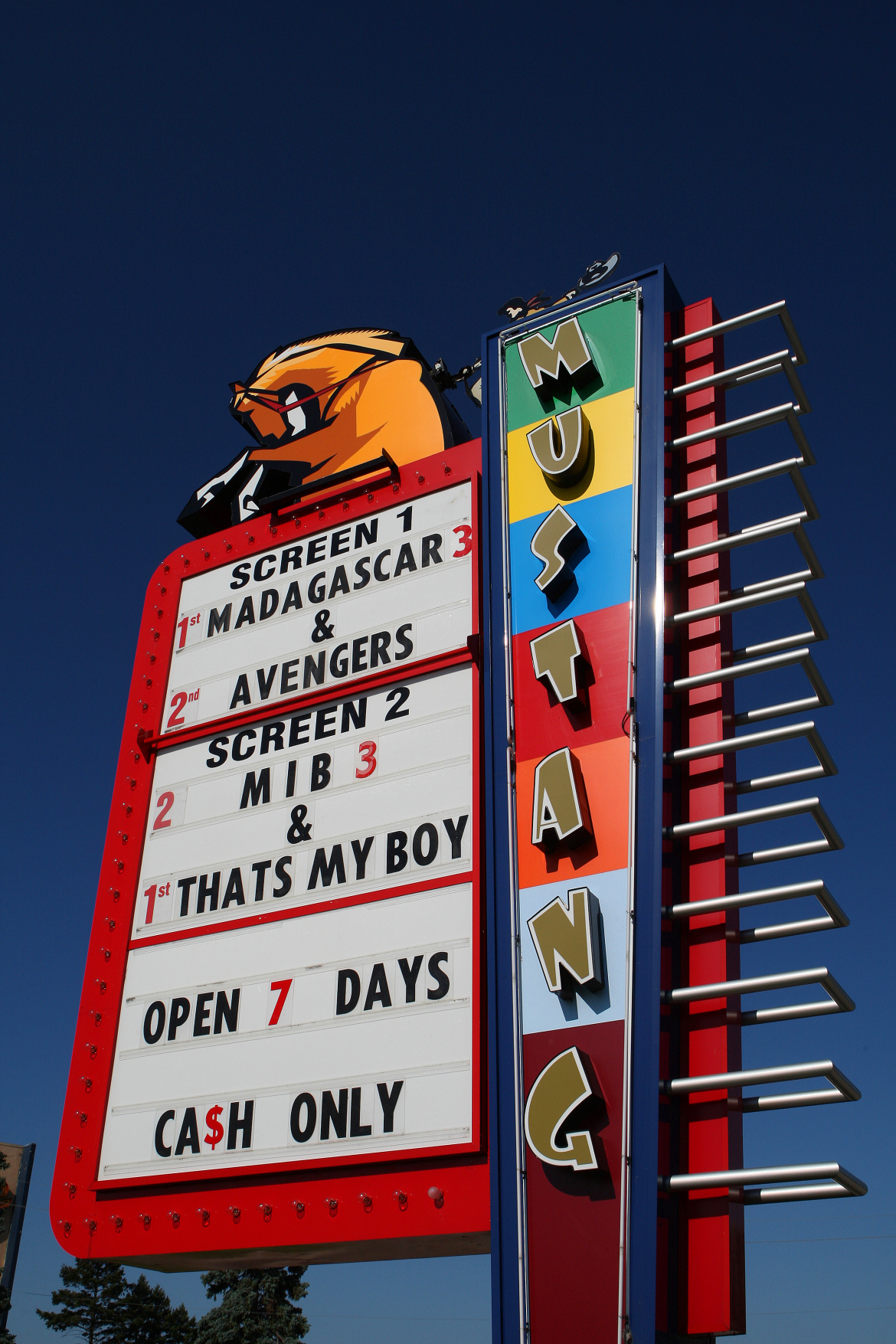 Movie sign from mustang drive in showing what movie are playing for that evening