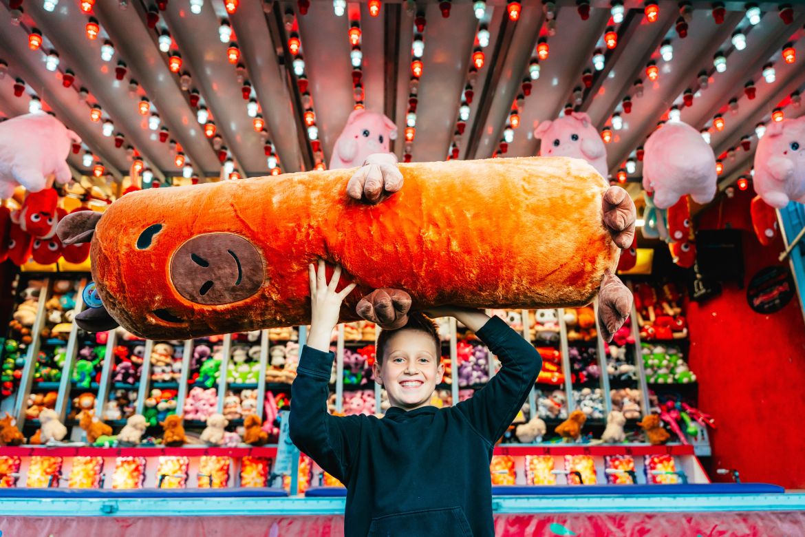 Kid holding a plushie 