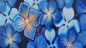 an art piece of a bunch of blue flowers with hints of orange and yellow in the centre of each created by karen caughlin
