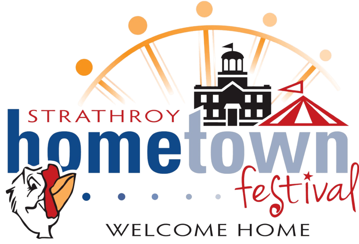 Logo for the Strathroy Hometown Festival featuring a stylized town hall building, a red circus tent, sunrise rays, and a rooster illustration, with the text “Strathroy hometown festival – Welcome Home.