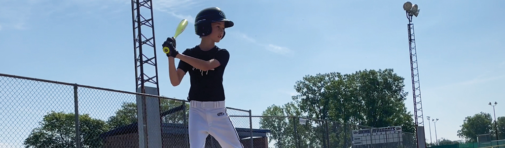 little boy playing baseball
