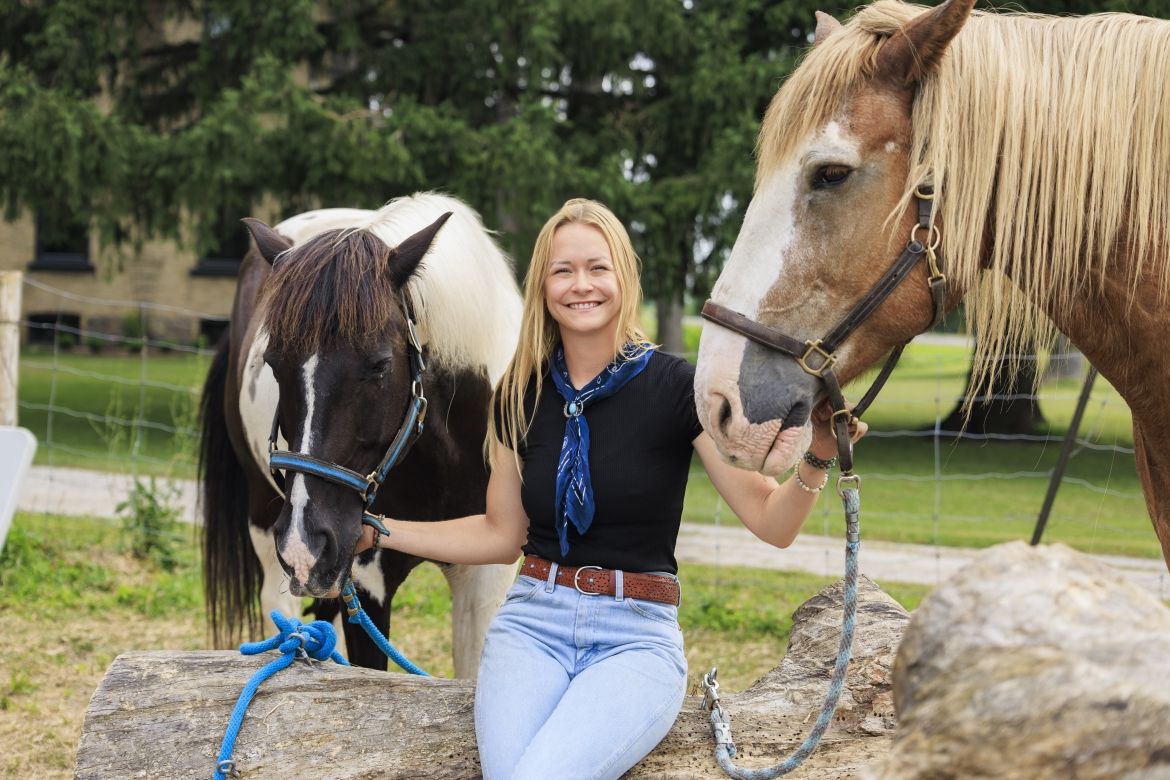 Woman with two horses