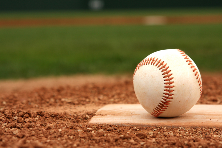 baseball on one of the bases of a baseball field