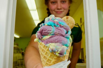 Woman handing over ice cream 